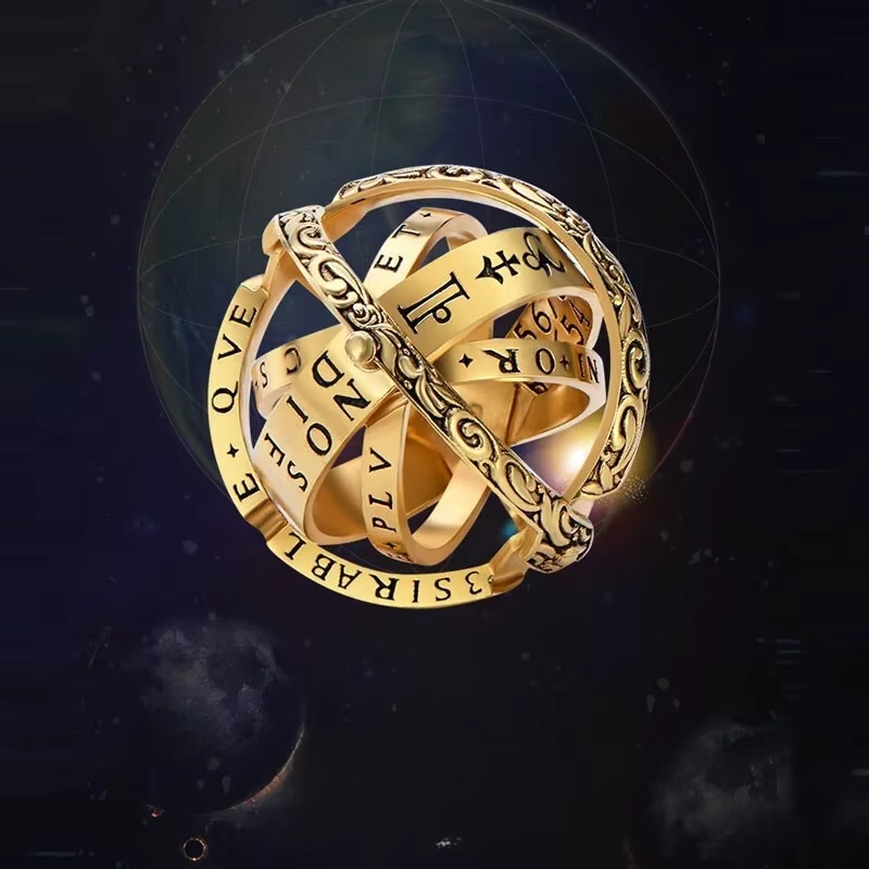 Golden armillary sphere with multiple interlocking rings adorned with symbols and numbers against a starry space background.