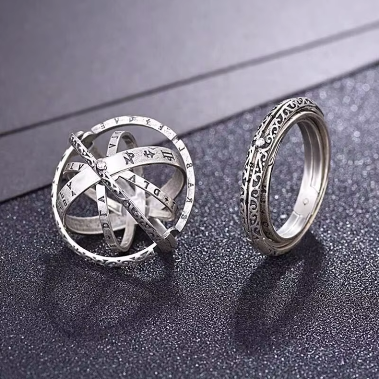 A mesmerizing astronomical-themed ball ring with interlocking bands.