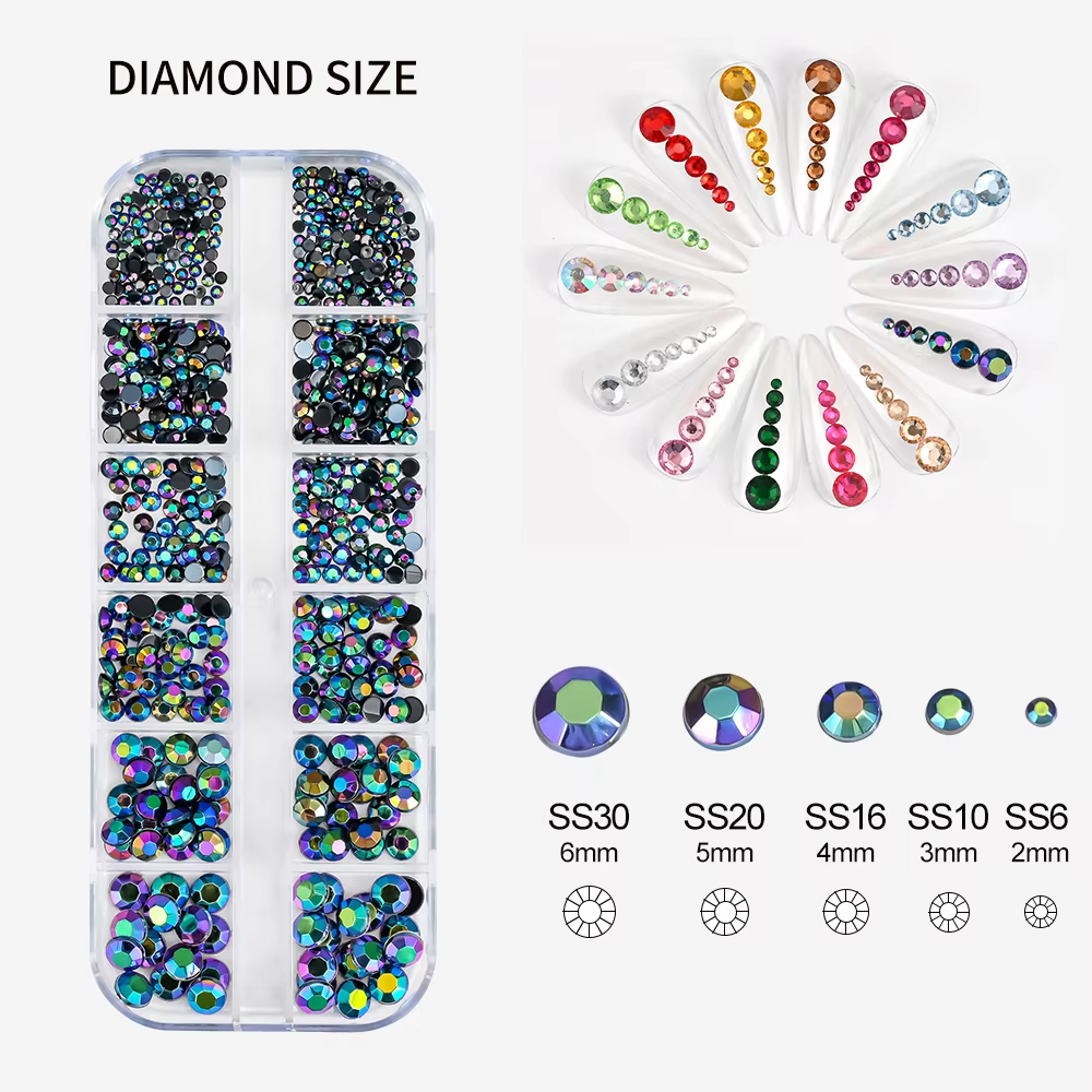 A collection of rhinestones in various sizes and colors, organized in a plastic container with multiple compartments.