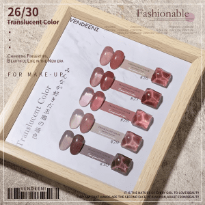 A wooden framed display of translucent nail polish samples from Vendeeni, labeled #26 to #30, with shades ranging from light pink to brown